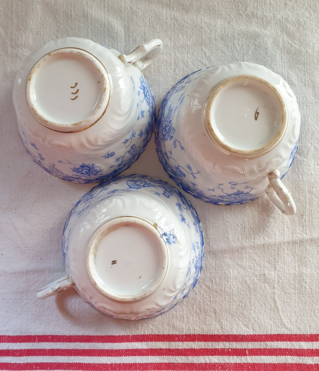 Trio of fine porcelain cups