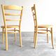 Paire chaises Baumann bois clair et cannage
