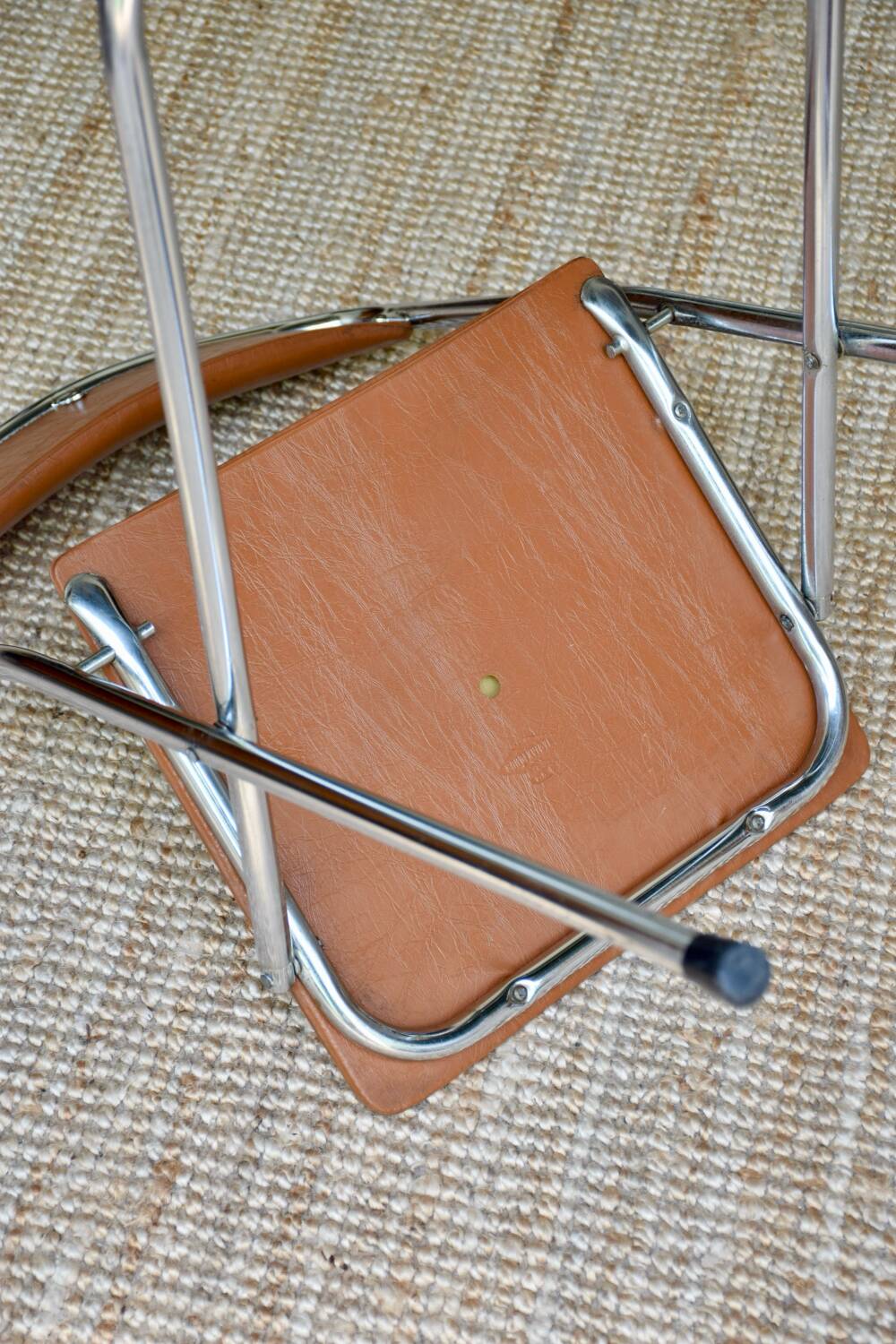 Pair of “Soudexvinyl” folding chairs in skai and chrome tube