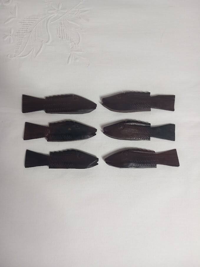 Antique wooden knife rests.