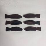 Antique wooden knife rests.