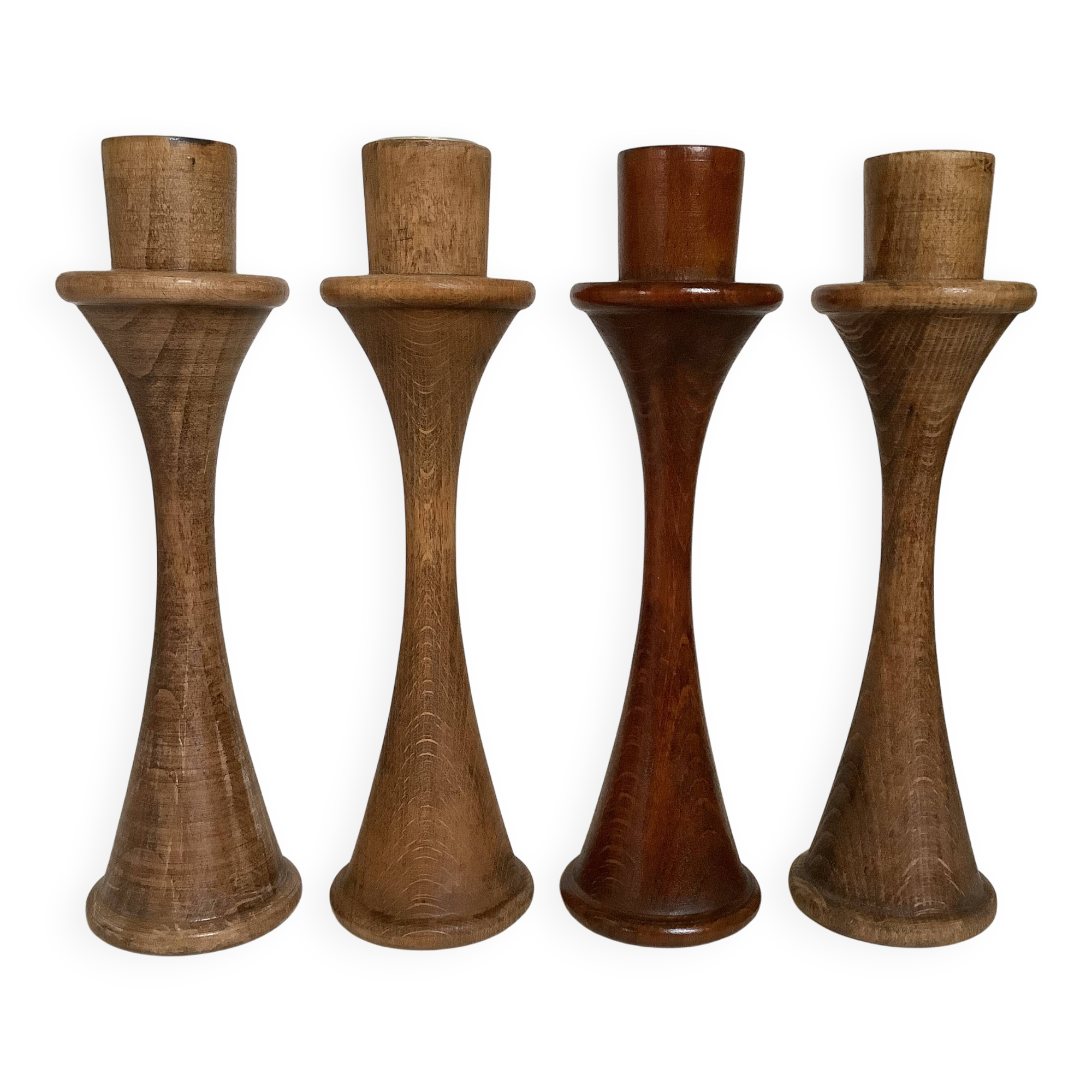 Four Scandinavian-style wooden candle holders