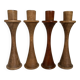 Four Scandinavian-style wooden candle holders