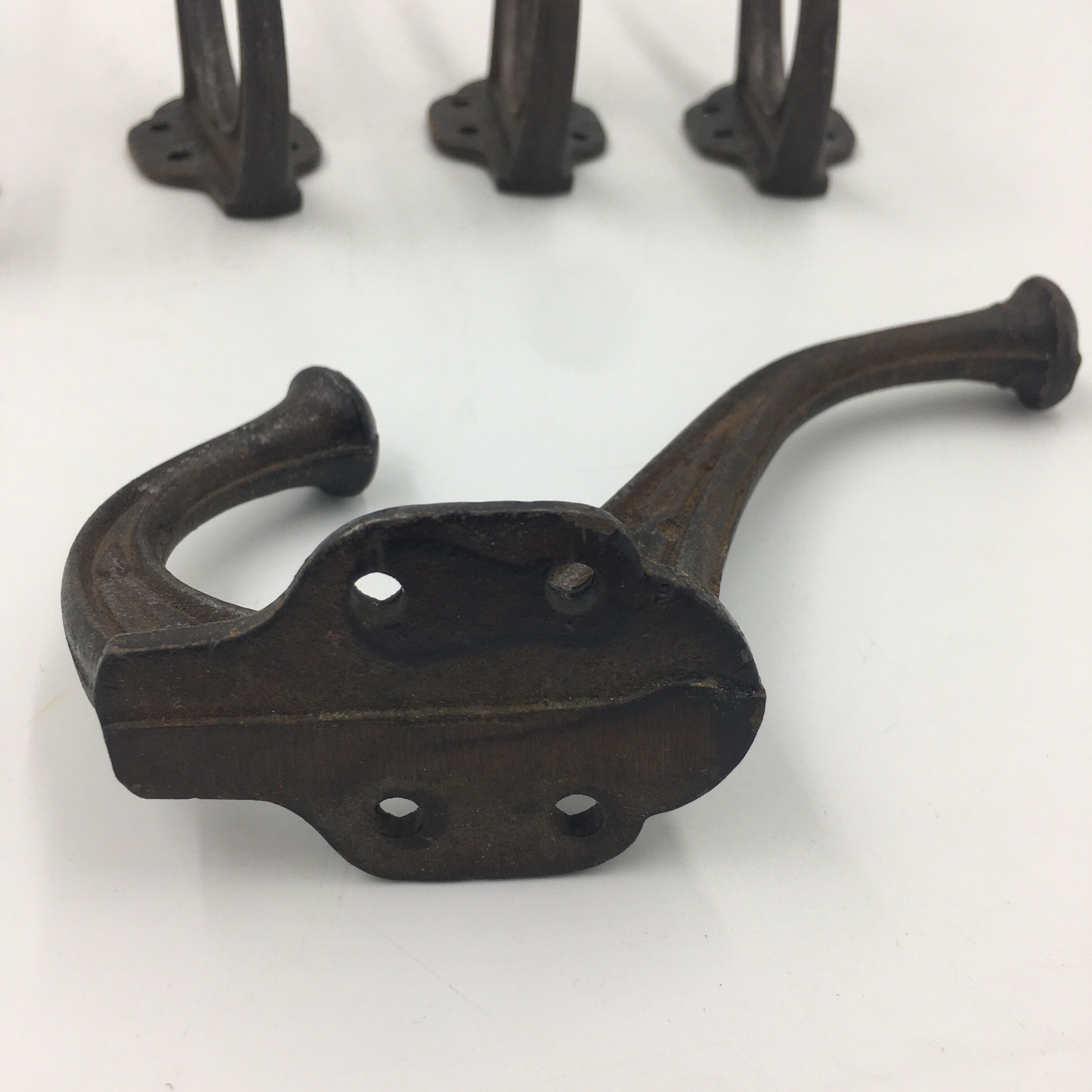 Set of 5 cast iron hooks early 20th