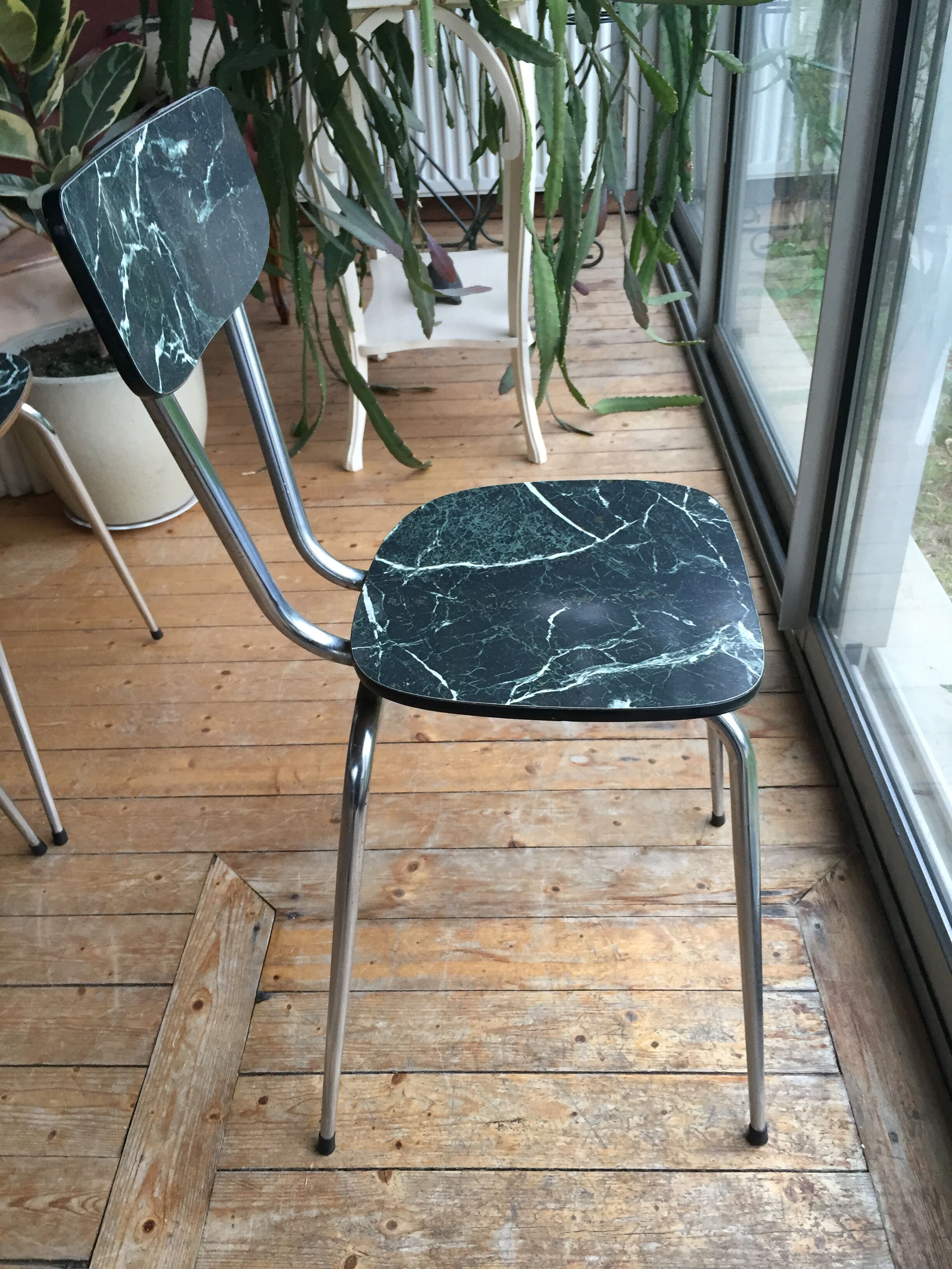4 chairs in very dark green formica marble effect