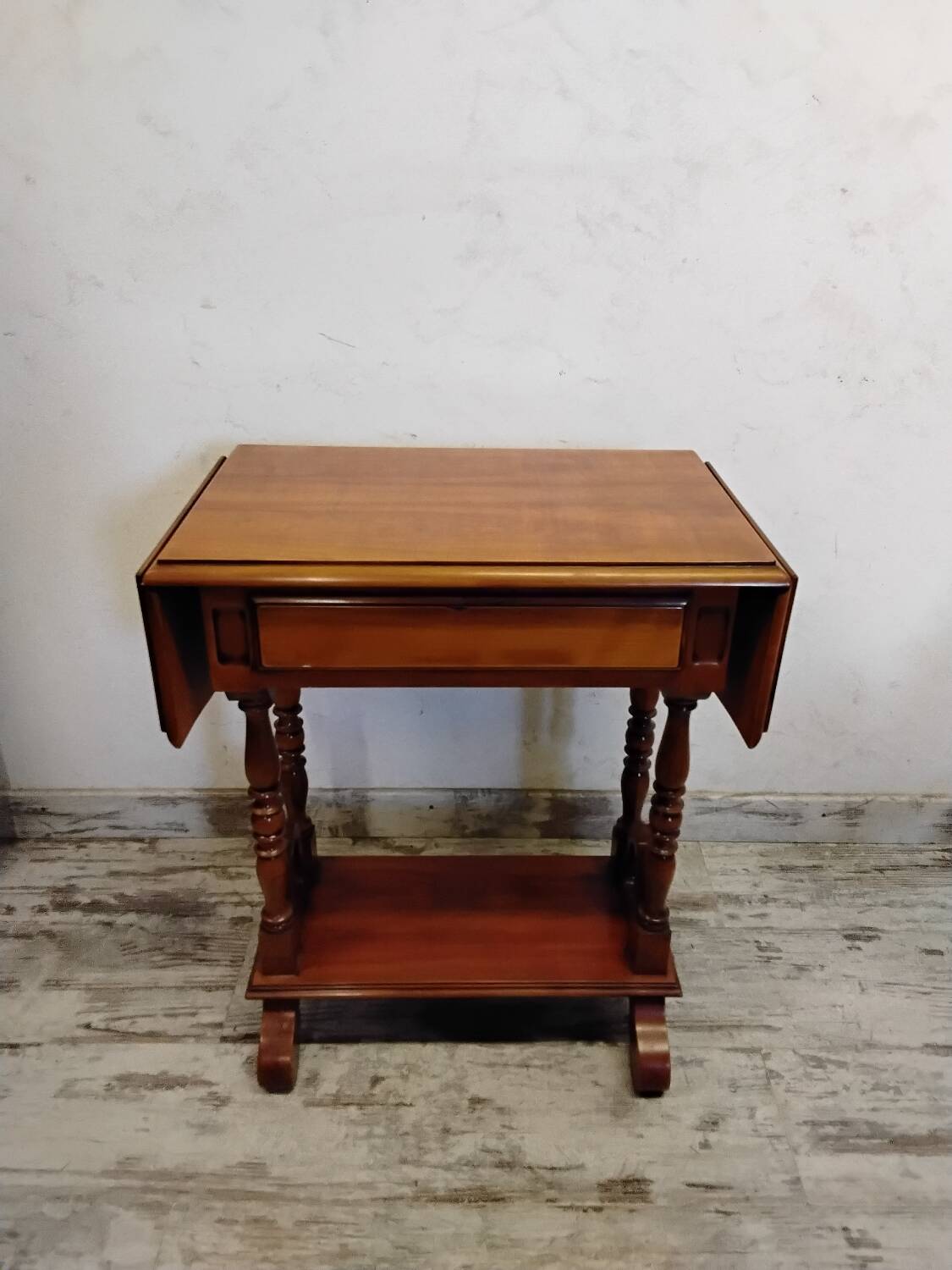 Small wooden drop-leaf table