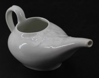 Old white earthenware sausage