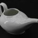 Ancien saucier en faïence blanche