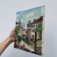 Old oil painting depicting a street in Montmartre