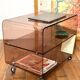 Smoked Plexiglas coffee table on wheels -