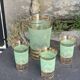 Serve an orangeade, a carafe and 3 glasses in green granite with golden trim.