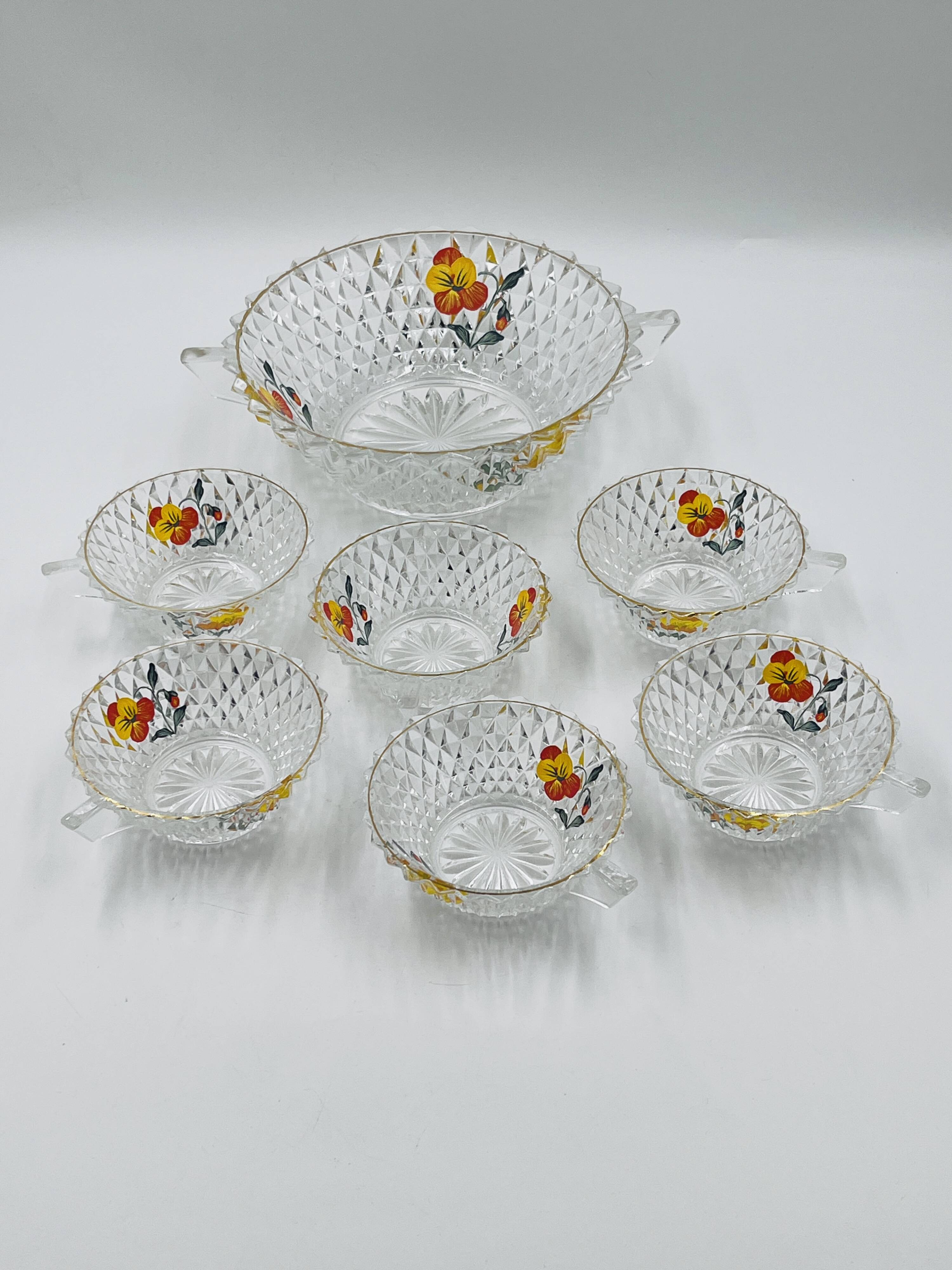 Vintage glass fruit salad serving set with a pansy design.