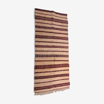 Old hand-woven Berber carpet hanging