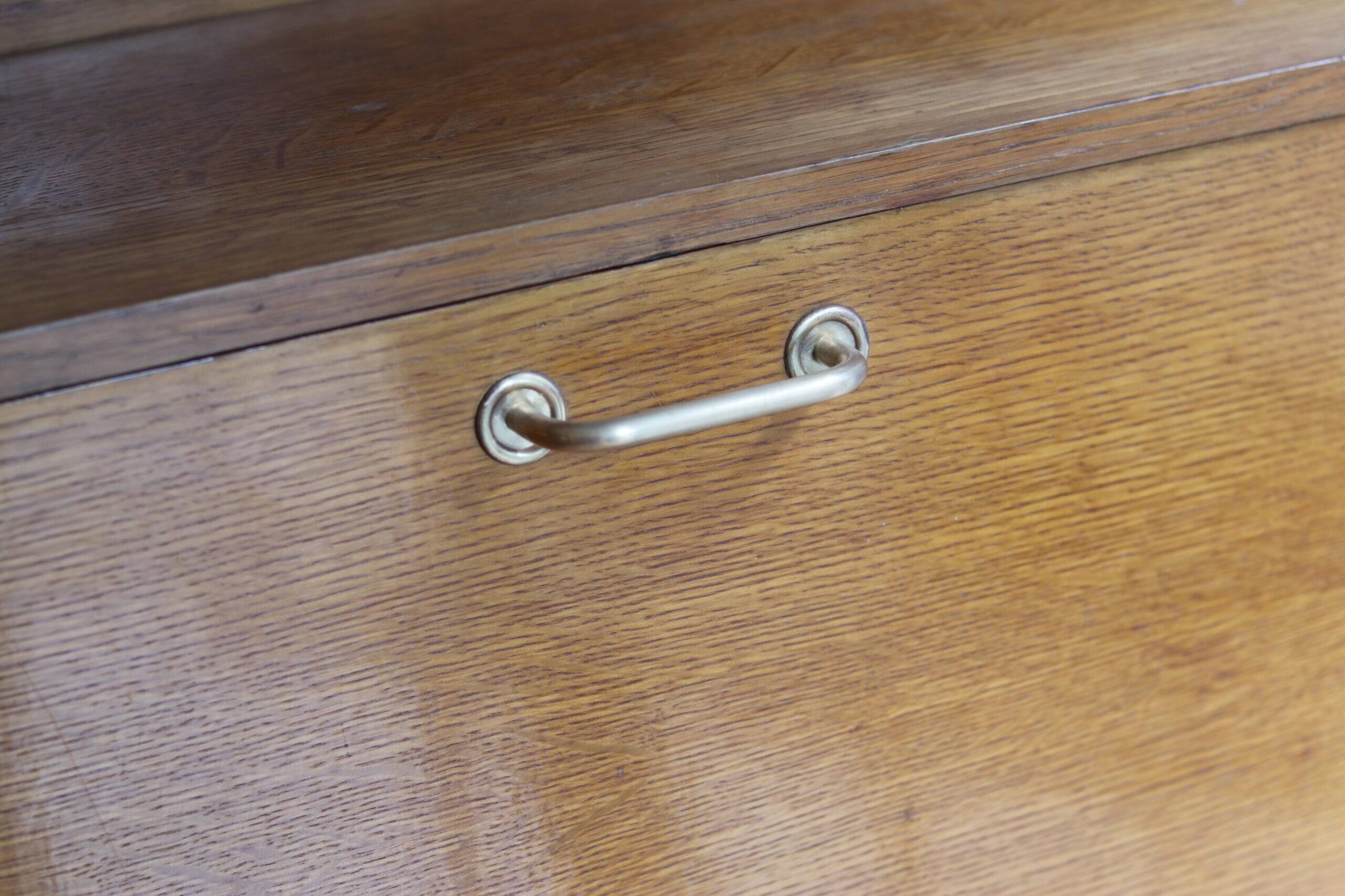 Vintage 1960s secretary in oak veneer with a drop-down front.