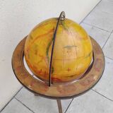 Old terrestrial globe world map on wooden stand