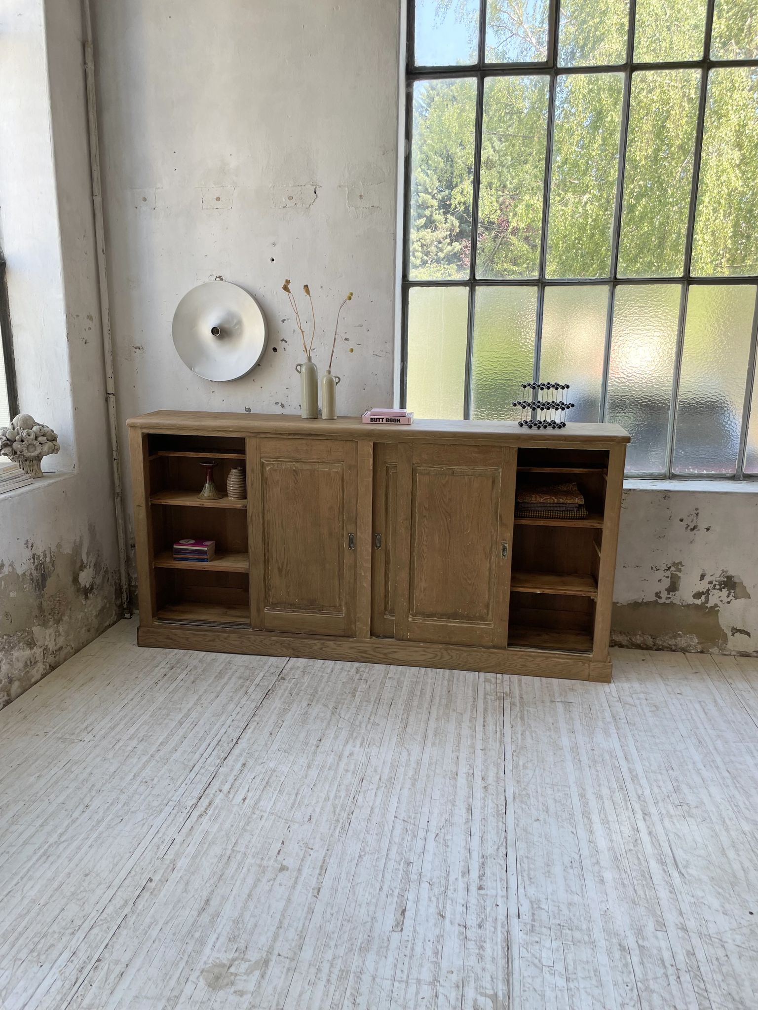 Large row of solid oak loom sliding doors