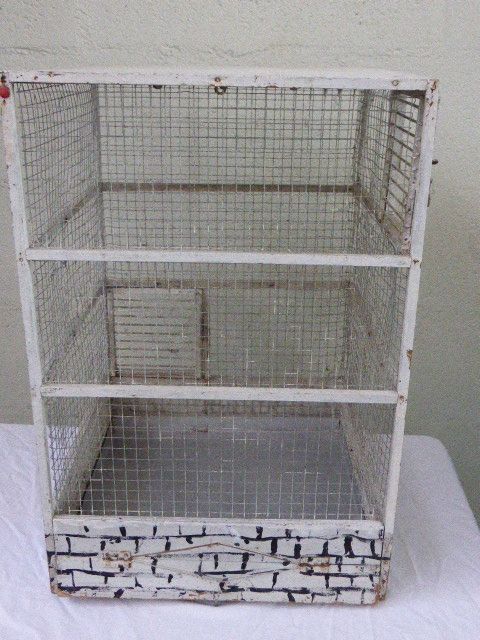 Vintage bird cage, made of wood and chicken wire metal square mesh