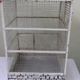 Vintage bird cage, made of wood and chicken wire metal square mesh
