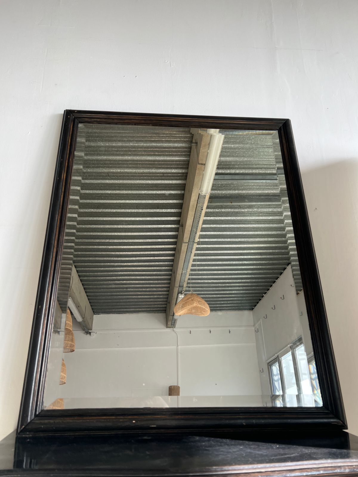 Rectangular mirror in molded blackened wood, beveled glass