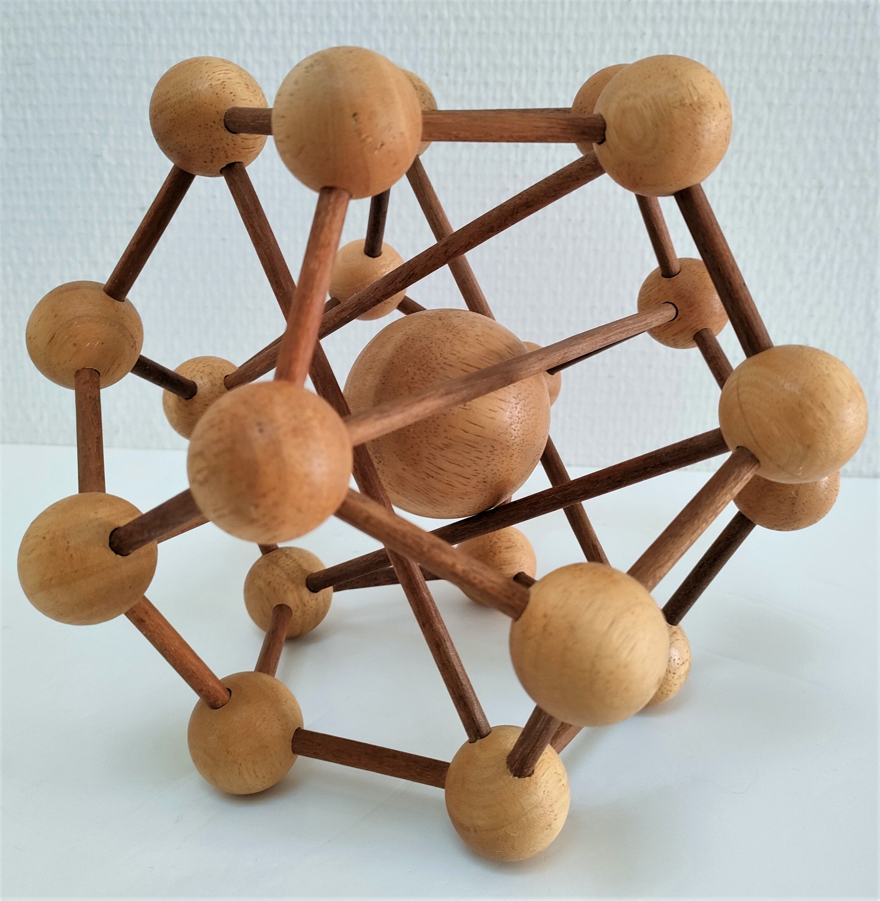 Sculptural modeling of a solid wood atom contemporary design
