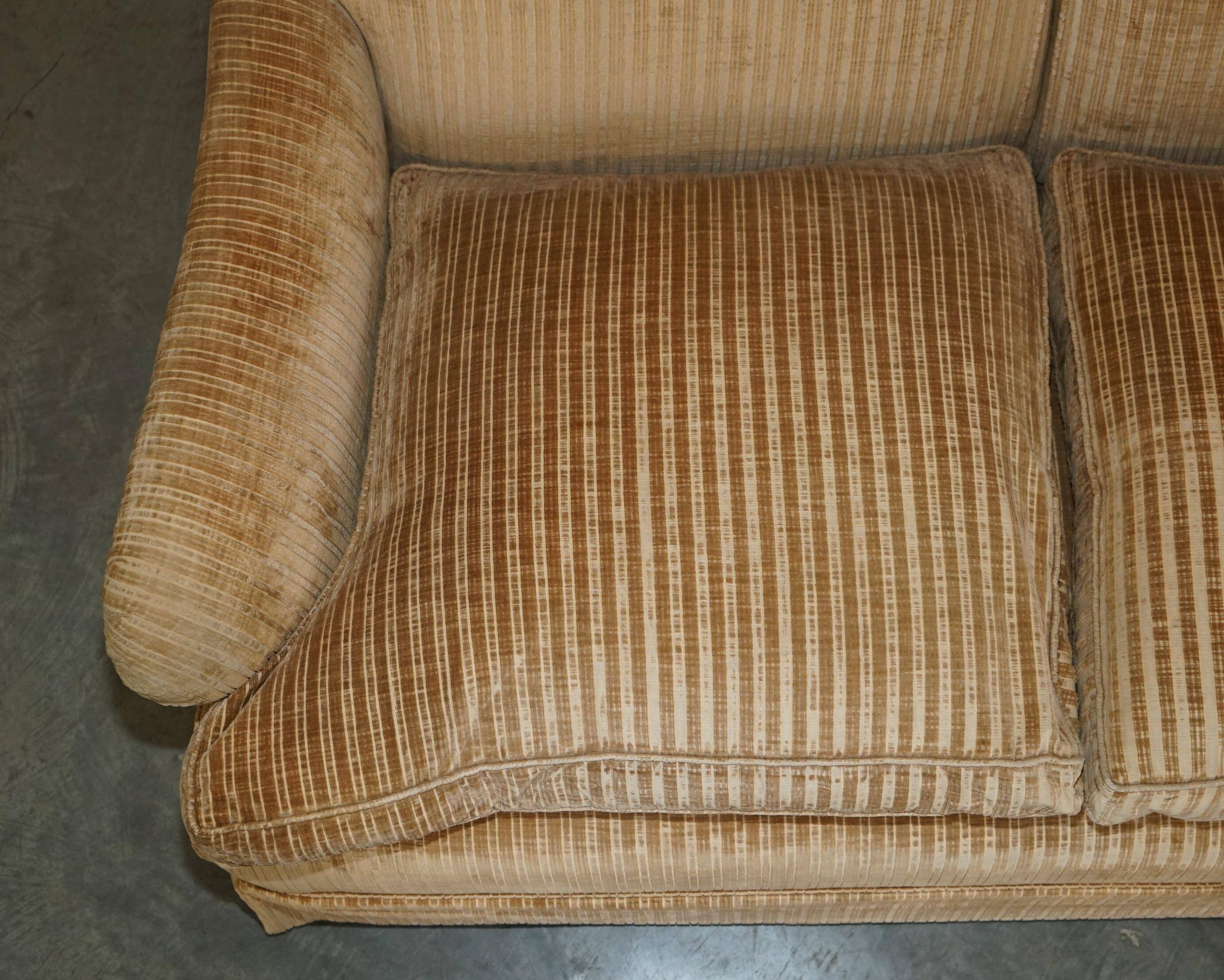 Howard & Sons / Chairs Ltd two-seater canapé with feather-filled cushions.