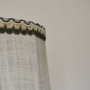 Turned wooden lamp with linen shade