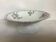 Old footed dish with gypsophila, white flowers.