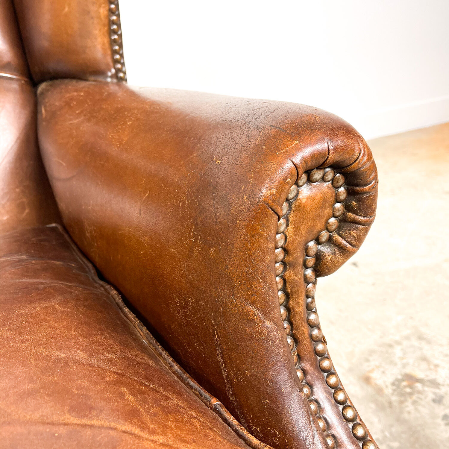 Dark brown sheep leather wingback armchair vintage