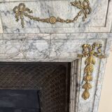 Louis XVI fireplace in veined grey marble with original gilded bronzes from the 19th century.