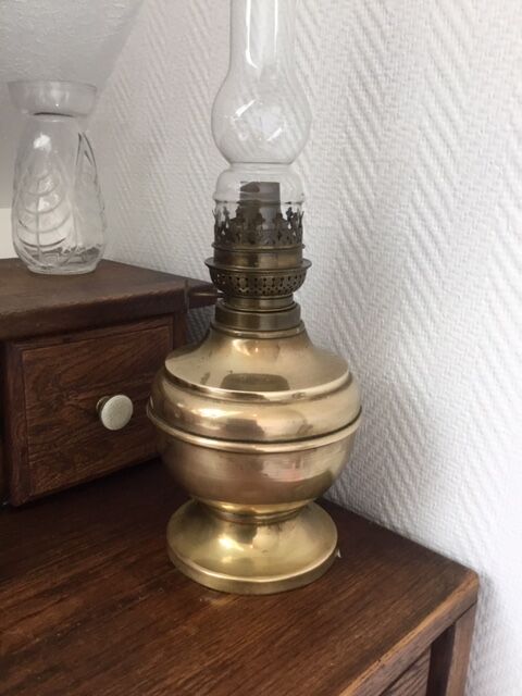 Old-fashioned brass standing oil lamp