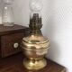Old-fashioned brass standing oil lamp
