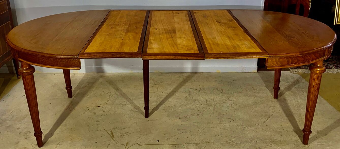 Louis XVI style table in oak with three extensions