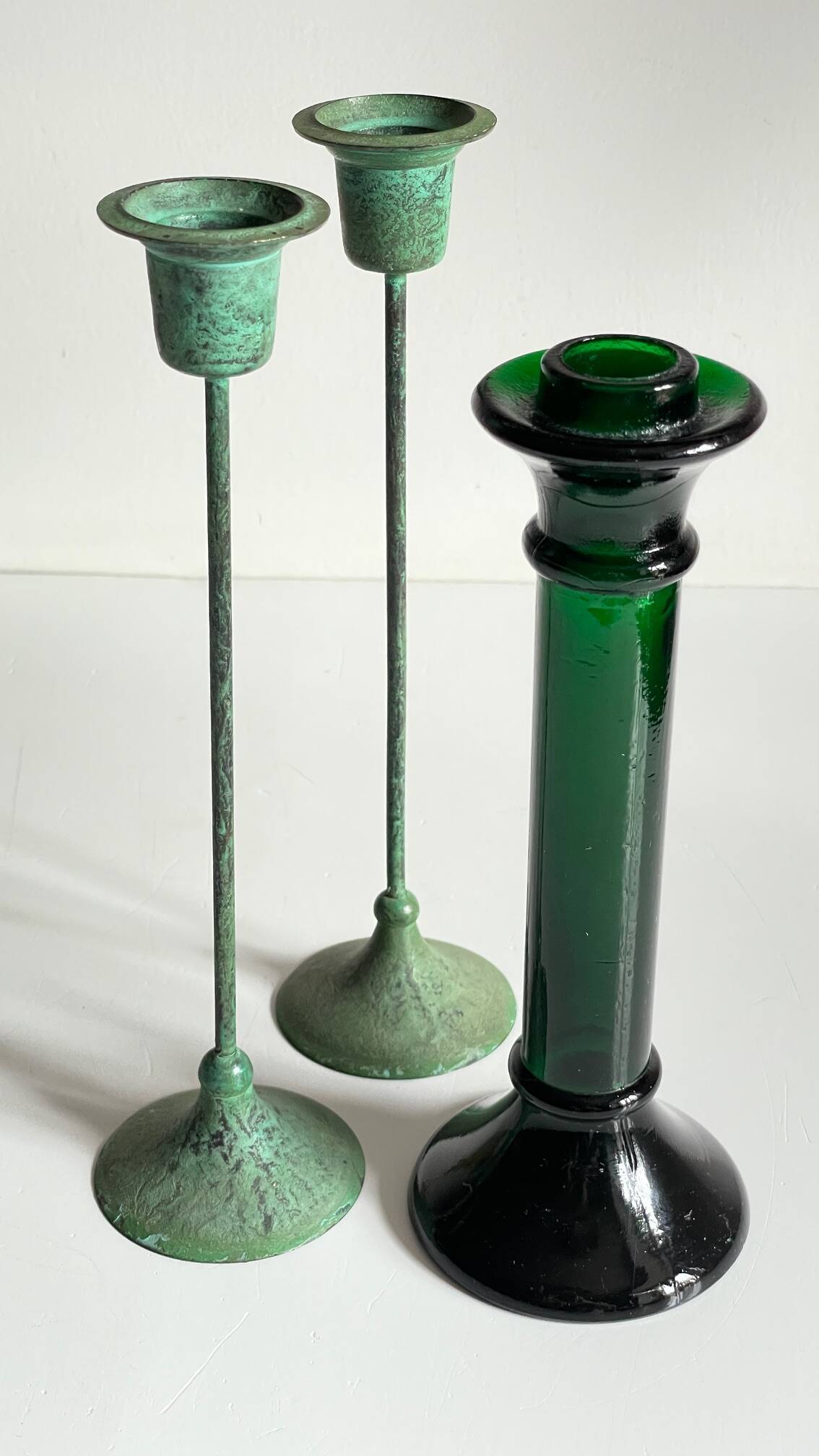 Green glass and metal candle holders