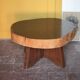 Brutalist wooden coffee table, cruciform leg with a tree trunk top.
