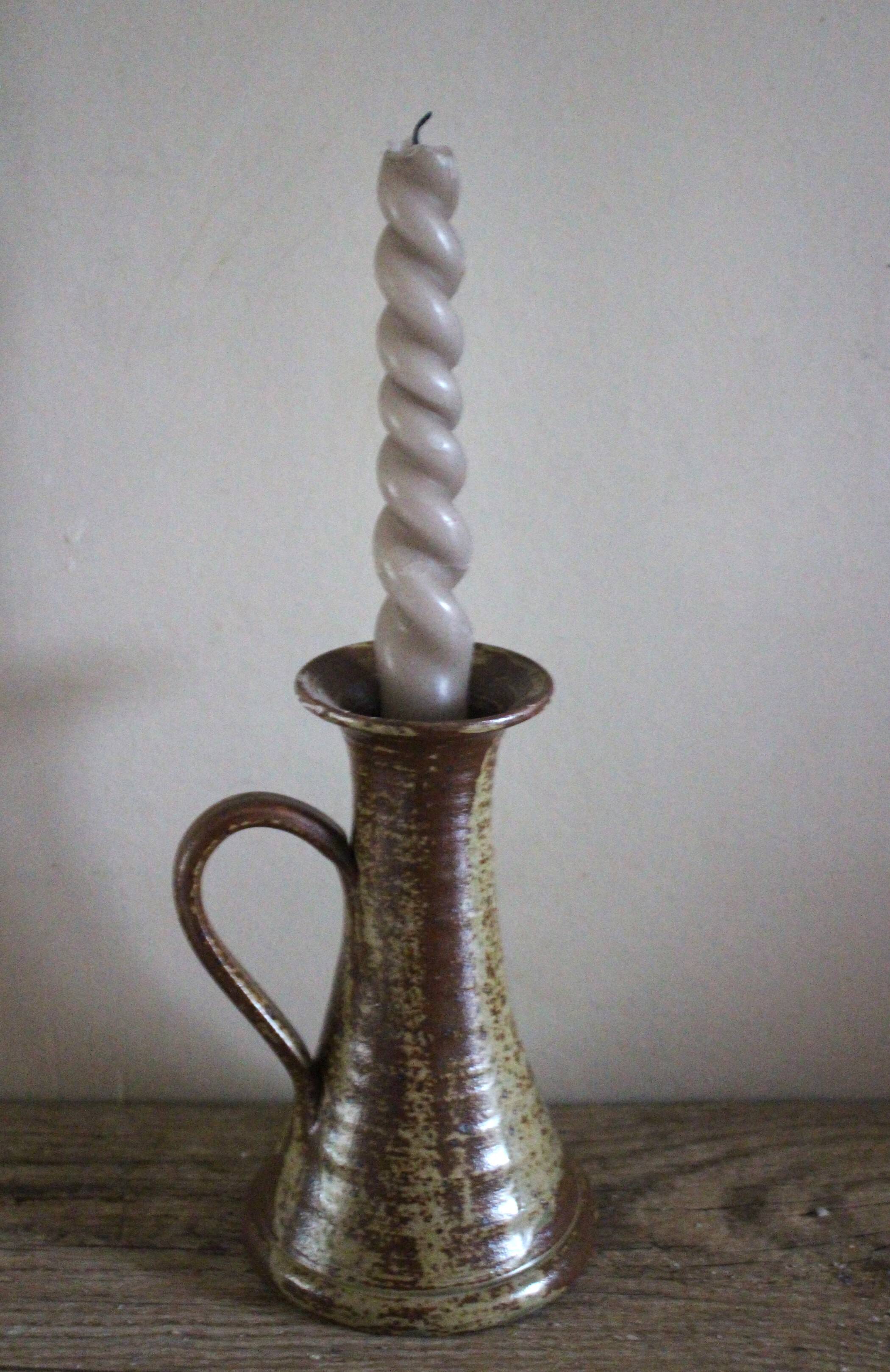 Vintage pyrite-glazed stoneware candlestick with handle