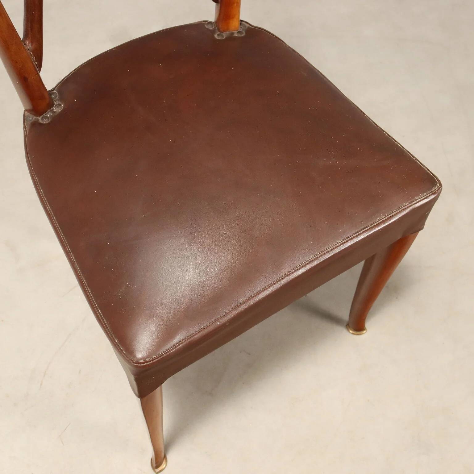 1950s chairs with wooden backs.