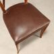 1950s chairs with wooden backs.