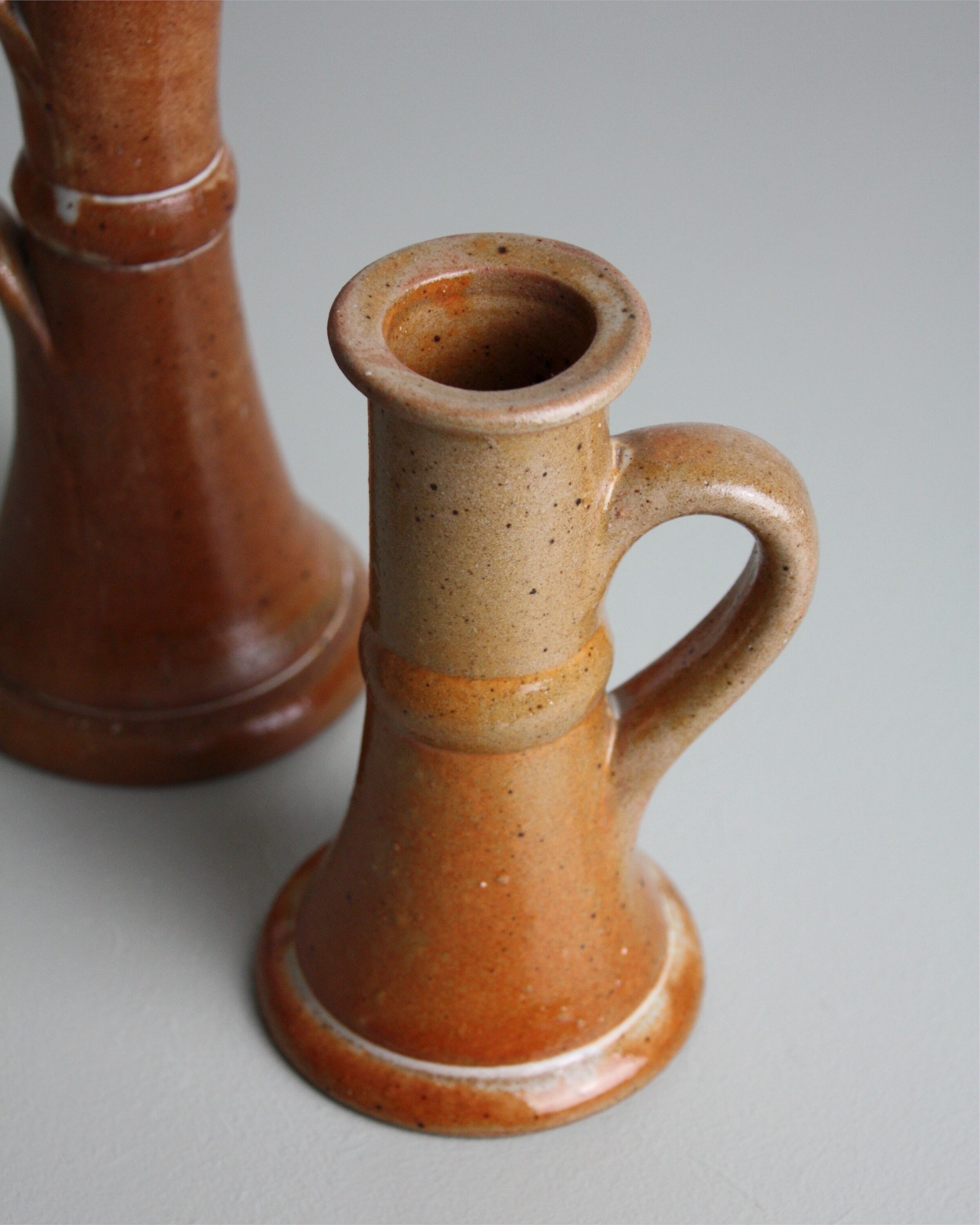 Trio of stoneware candle holders