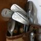 Old golf bag with 5 golf clubs