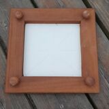 Underside of flat wood and faience floral pattern - retro