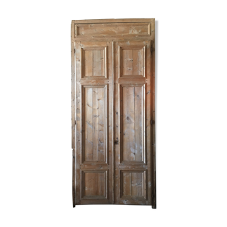 Double closet in massive pine door