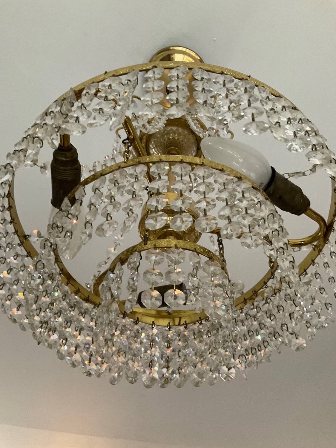 Cascade chandelier with crystal and brass tassels