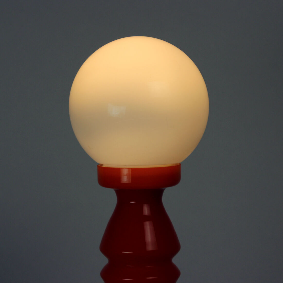 Orange glass table lamp by vitropol, poland 1960s
