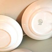Set of six flat plates and one Moulin des Loups bowl, green tablecloth model/1950s-1960s