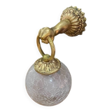 Vintage wall light in gilded bronze with a cracked glass globe.