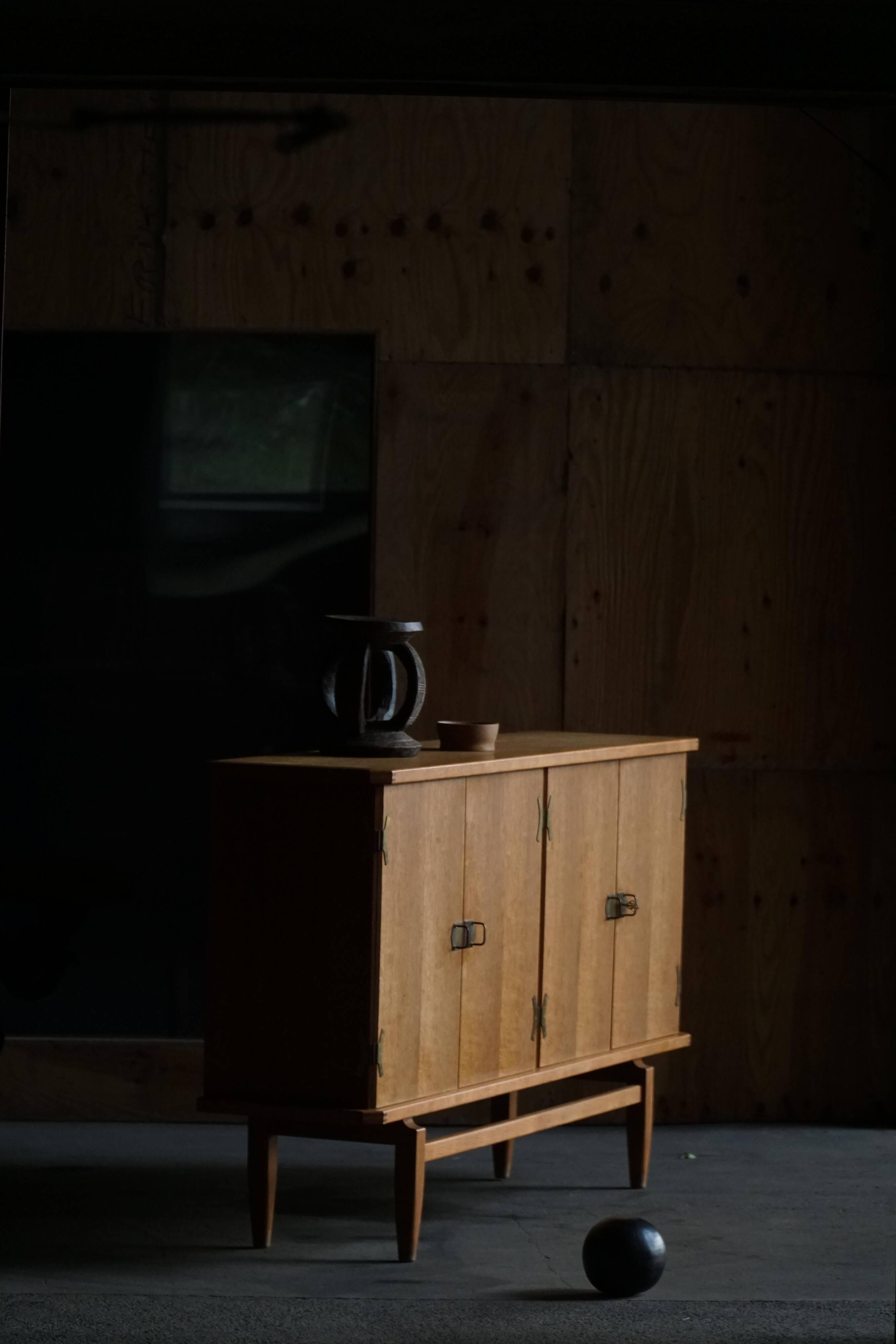 Oak and brass buffet by Henning Kjærnulf, Mid-century modern Danish, 1960s.
