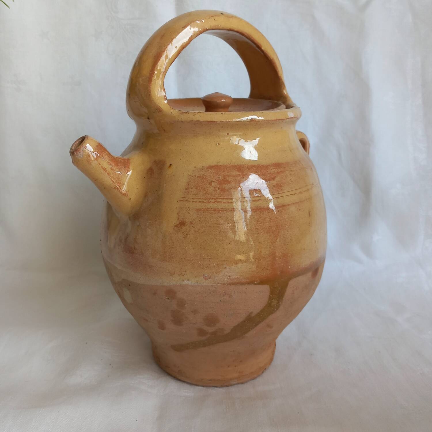 Jug, small terracotta pitcher with yellow glaze