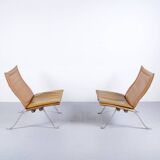 Imposante paire de fauteuils cuir et acier années 60'