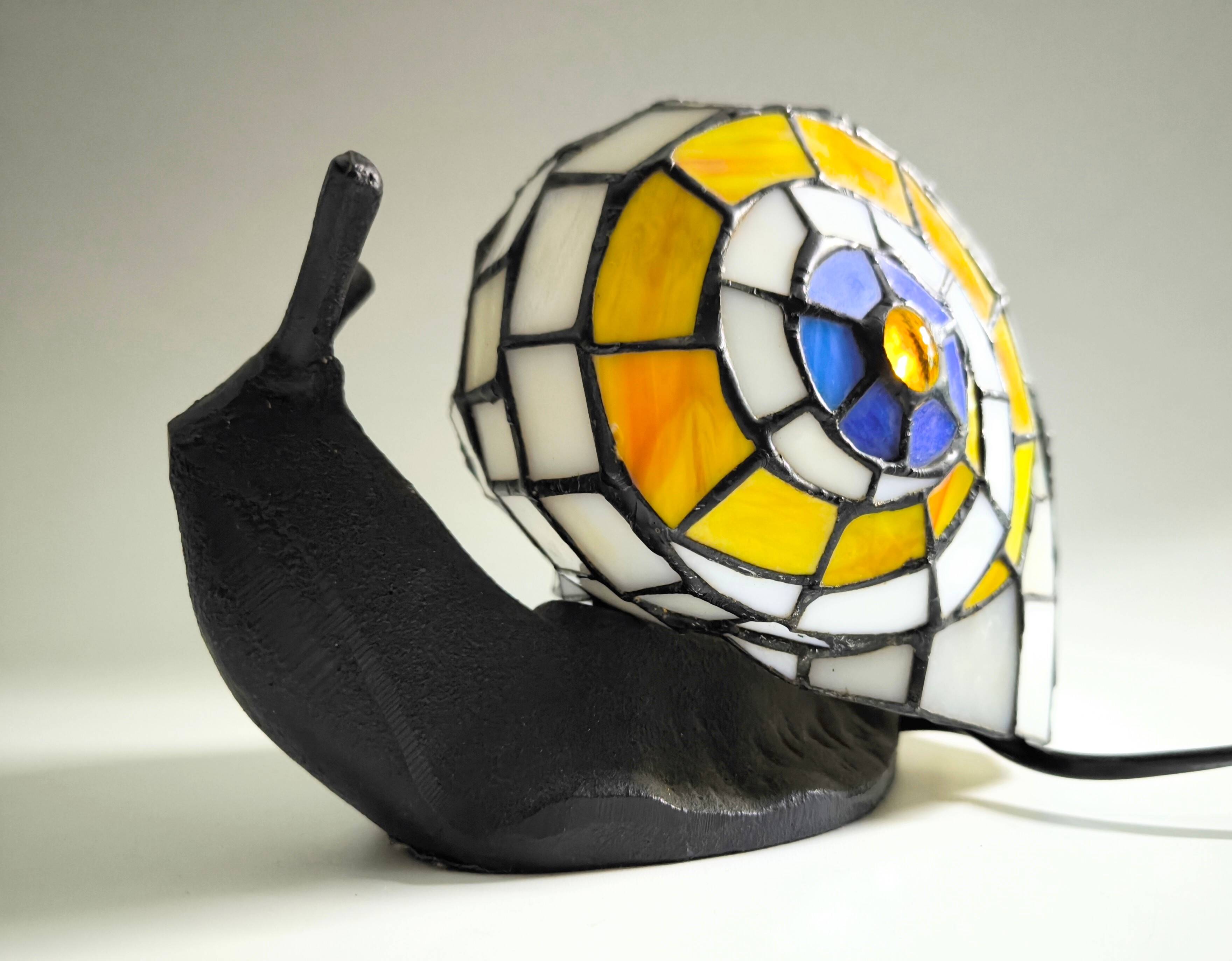 Tiffany-style lamp in the shape of a snail.