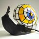 Tiffany-style lamp in the shape of a snail.